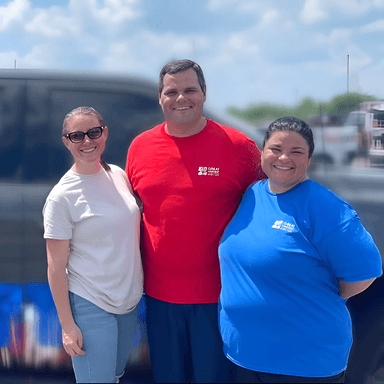 Three Great Harvest franchise owners in Great Harvest apparel